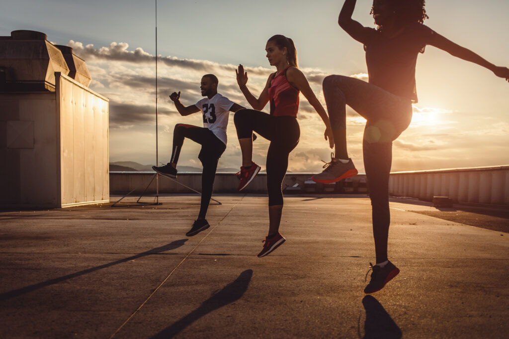 Small Group of Athletes Exercising Outdoors